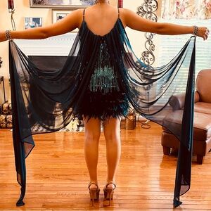 Brand new, green sequin fringe dress with feather detail.